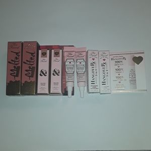 Too Faced minis 2 of each, lip gloss, face primer